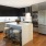 kitchen and living area with an island and bright, natural lighting