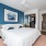 bedroom with a closet, large, spacious areas, and bright lighting from large patio doors